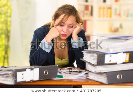 [[stock_photo]]: Overworked Businesswoman Leaning At Desk