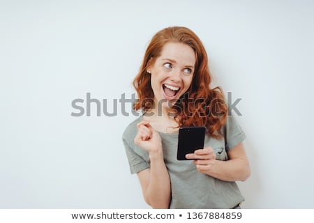 Stock photo: Vivacious Woman Reacting To A Text Message