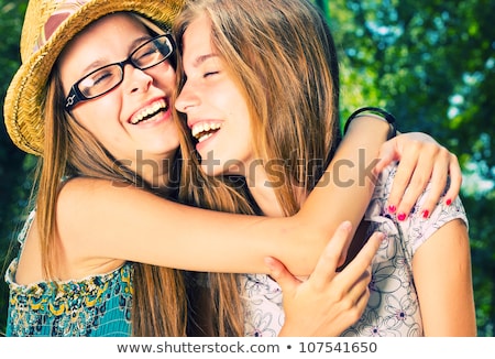 Сток-фото: Portrait Of Happy Two Sisters Outdoors Having Fun