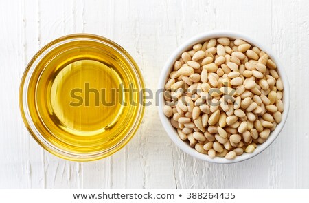 Stockfoto: Pine Nuts In White Bowl