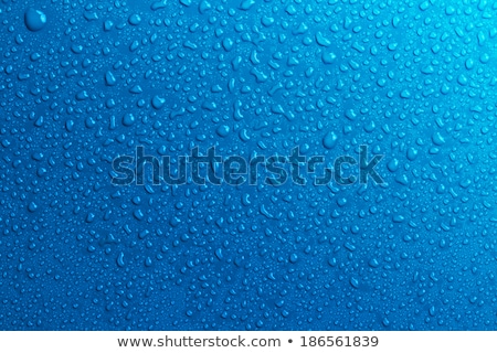 Foto stock: Ota · de · água · abstrata · na · superfície · da · água · azul