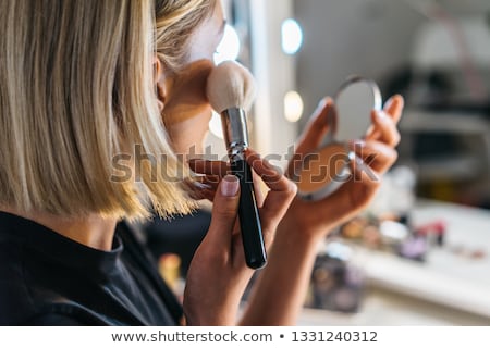 [[stock_photo]]: Beautiful Woman Doing Make Up On Face With Cosmetic Brush