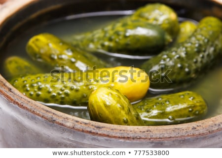 Foto stock: Pickled Cucumbers In A Clay Bowl