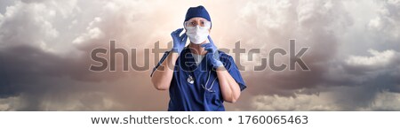 Doctor Or Nurse Adjusting Medical Face Mask Wearing Personal Pro Zdjęcia stock © Photoroyalty