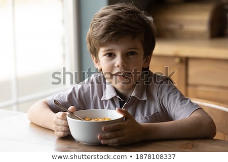 Stock photo: Boy In Everyday Eating Pose