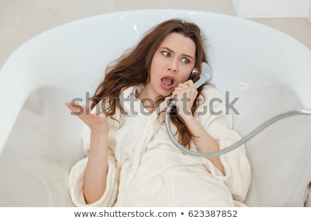 Zdjęcia stock: Woman Pretending Talking On Phone With Shower In Bathroom