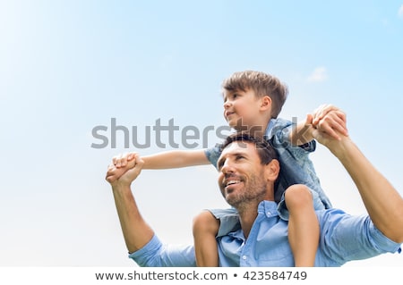 Сток-фото: Giving Piggyback Ride To Little Son