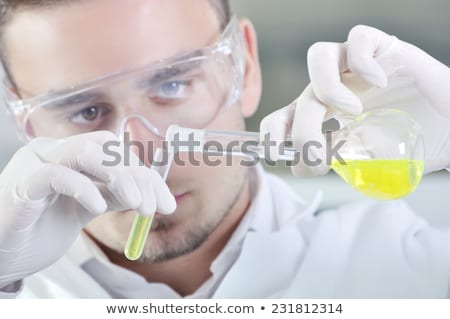Сток-фото: Young Male Chemist Working In The Lab