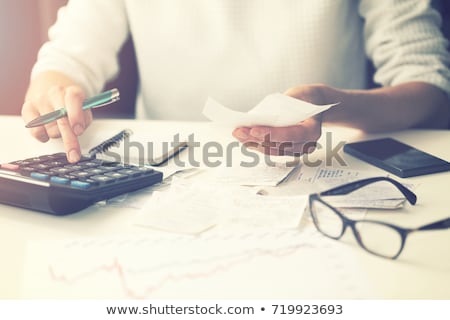 Foto stock: Woman Counting Expenses
