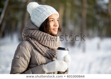 Foto d'archivio: Woman In Hat And Scarf Over Winter Forest