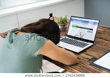 Stok fotoğraf: Woman Fell Asleep White Waiting For Slow Download