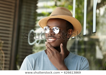 Сток-фото: Image Of Young African American Guy Smiling And Touching His Hea