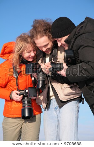 Foto d'archivio: Three Fotographers Against Blue Sky 3