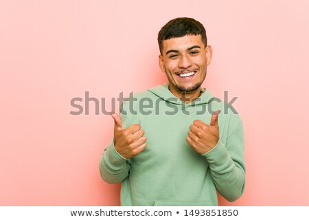 Foto stock: Happy Ethnic Man Thumbs Up Success