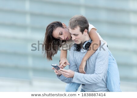 Foto stock: Young Boy Embracing His Pretty Girlfriend