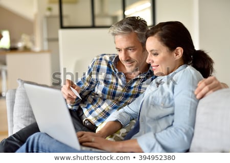 Zdjęcia stock: Middle Aged Couple Shopping Online
