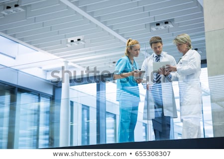 Foto stock: Hospital Nurse Standing In A Corridor