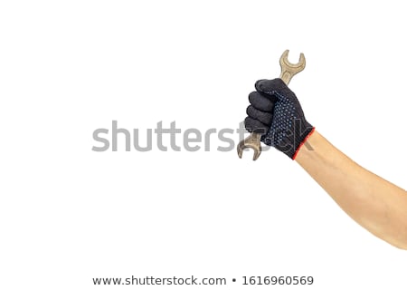 Foto stock: Hand Holding An Adjustable Wrench