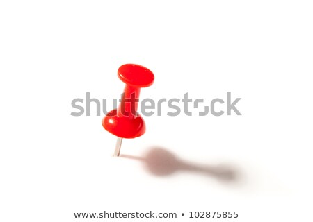 Foto stock: Red Push Pin Against A White Background