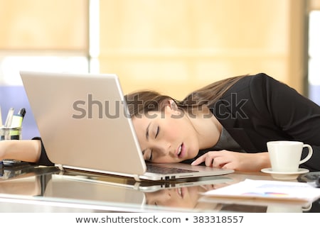 ストックフォト: Young Tired Businesswoman Sleeping At Her Workplace In Office