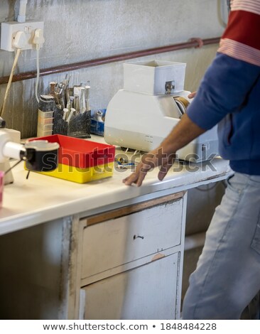 Сток-фото: Optician Man Checking A Pair Of Eyeglasses