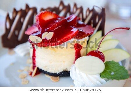 Foto stock: Chocolate Cheesecake With Whipped Cream And Cherry