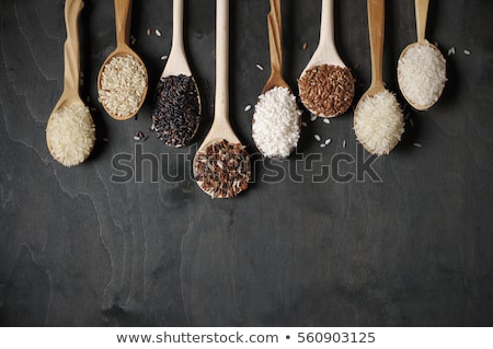 Stock photo: Raw Rice Grain Organic Food Background Ear Of Rice Or Ear Of Paddy Golden Spike Rice Field With