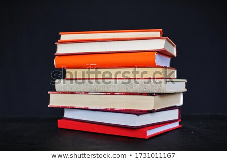 Foto stock: Stack Of Books On The Black Background