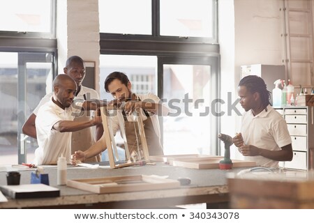 Zdjęcia stock: Carpenter Holding Wooden Frame