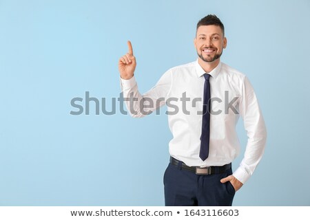 Stock photo: Portrait Of A Businessman Searching For The Index