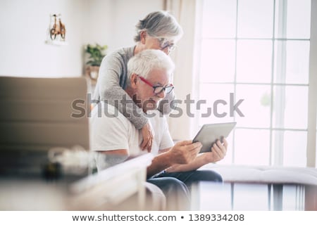 Stockfoto: Senior Couple Using The Mobile Phone