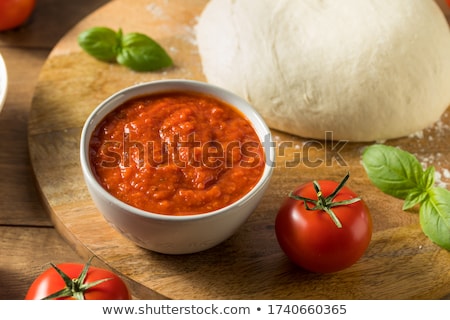 Сток-фото: Freshly Prepared Sauce In Bowl With Wooden Spoon