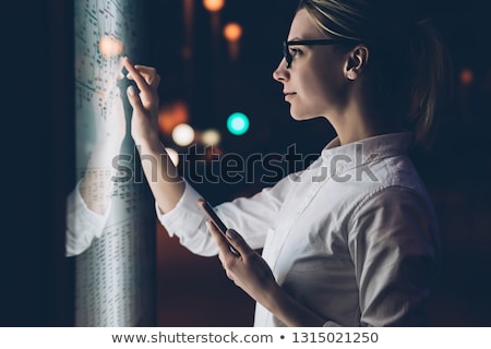 Foto stock: Young Woman Using Fingers As Glasses