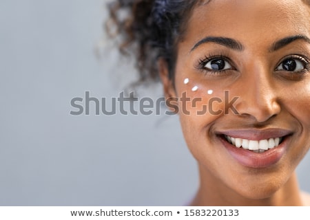 Stock photo: Girl With Cream Dots On Face