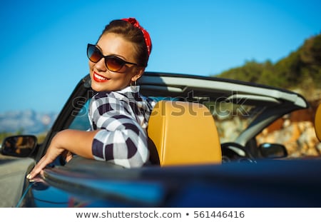 Stockfoto: Beautiful Pin Up Woman Sitting In Cabriolet Enjoying Trip On Lu