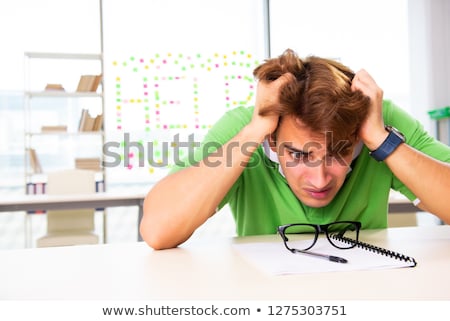 [[stock_photo]]: Student Struggling At The Exam In Classroom