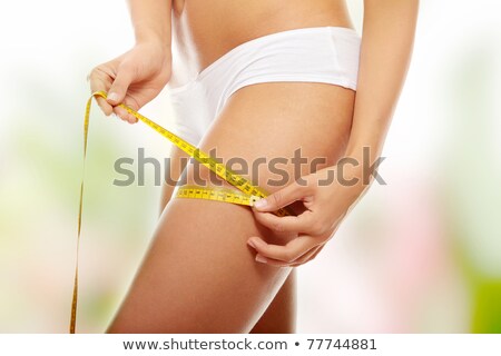 Foto stock: Closeup Photo Of A Caucasian Womans Leg With A Measuring Her Th