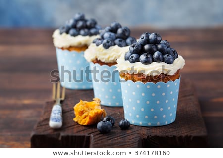 Zdjęcia stock: Pumpkin Cupcakes With Cream Cheese Blueberries