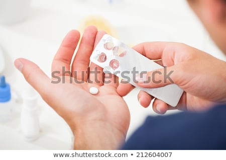 Zdjęcia stock: Hand With Pills Blisters