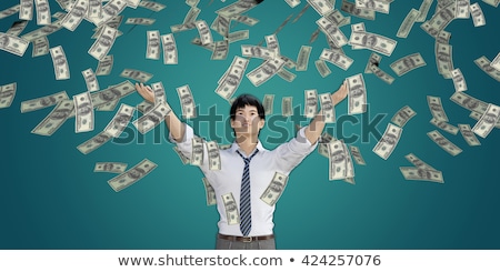 Asian Man Catching Money Falling From The Sky Stok fotoğraf © kentoh