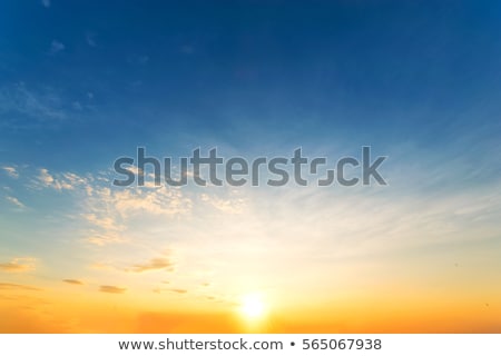 Foto stock: Plane In Blue Sky - Bright Red Sky