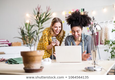 [[stock_photo]]: Female Tailor Talking By Phone