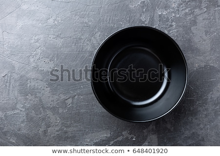 [[stock_photo]]: Empty Black Soup Plate On Dark Grey Background Top View