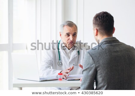 Zdjęcia stock: Nurse Examining Senior Man With Stethoscope