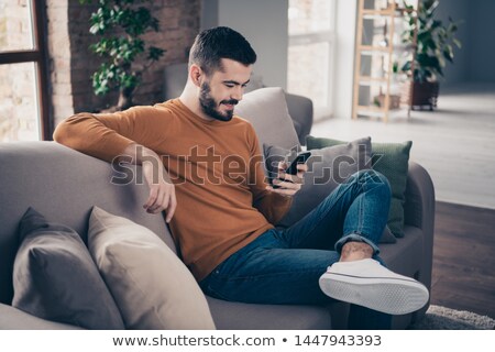 Stock fotó: Portrait Of Smart Casual Man Sitting And Looking To Side