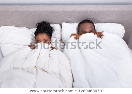 Stock fotó: Couple Trying To Hide In Blanket