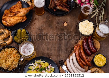 Stock photo: Beer Pretzels Sausages And Stewed Sauerkraut