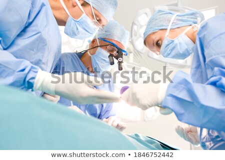 [[stock_photo]]: Surgical Doctor In Full Concentration On Operation