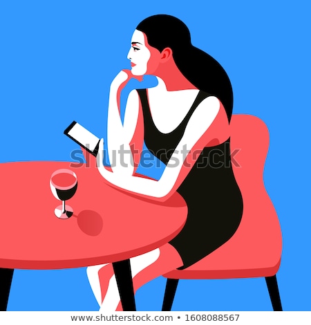 Stock photo: Girl Sits In Bar With Glass In Hand