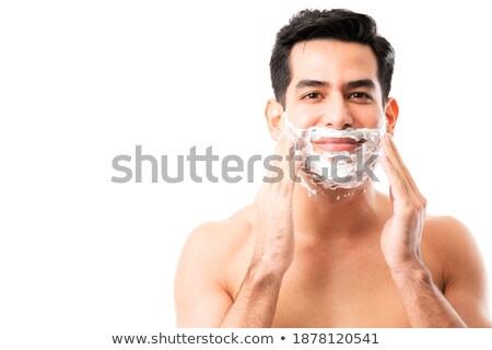 Foto stock: Man Taking Out His Shaving Foam On His Hand